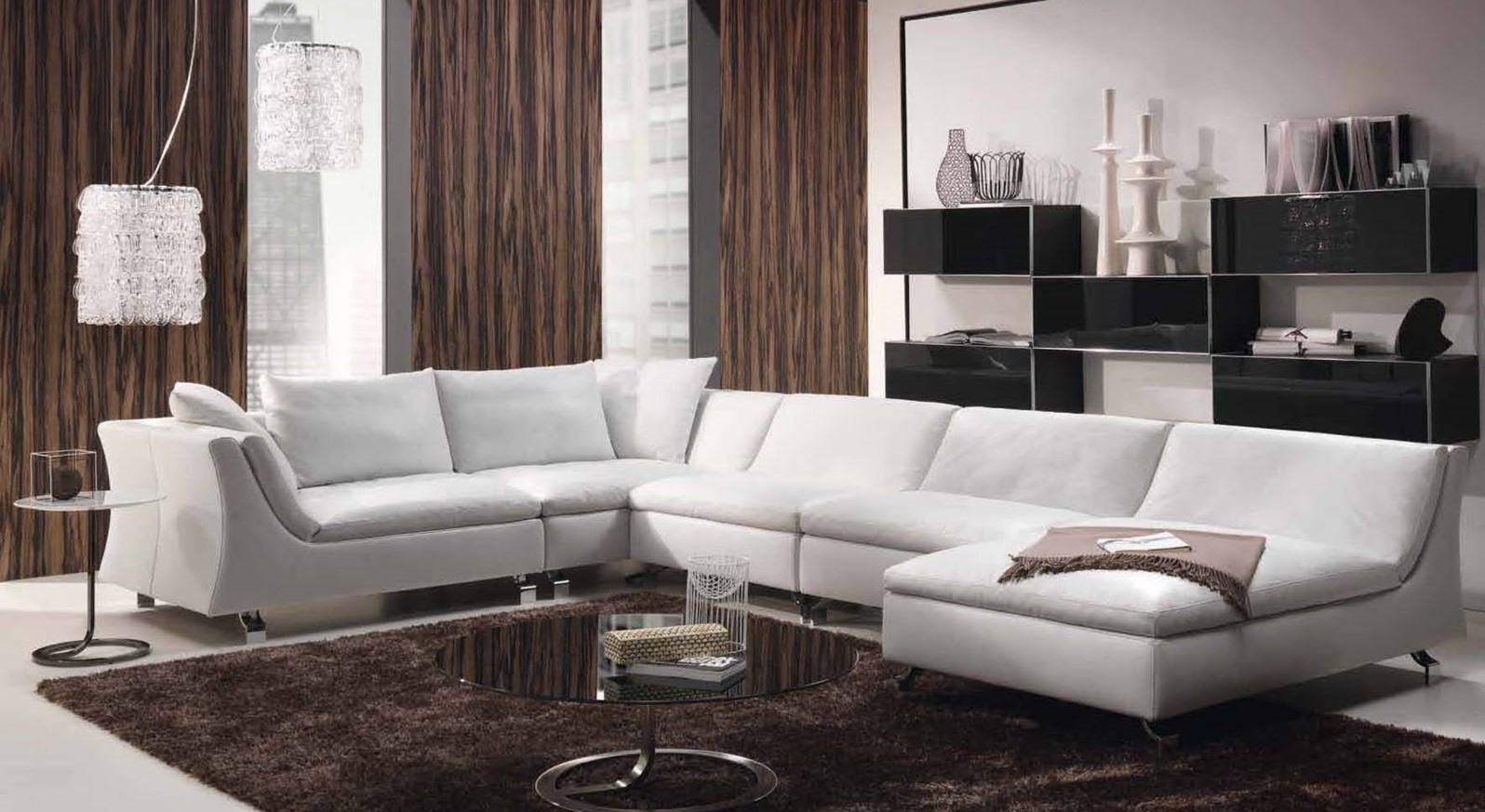 Серый диван подойдет для современного интерьера и для стиля минимализм