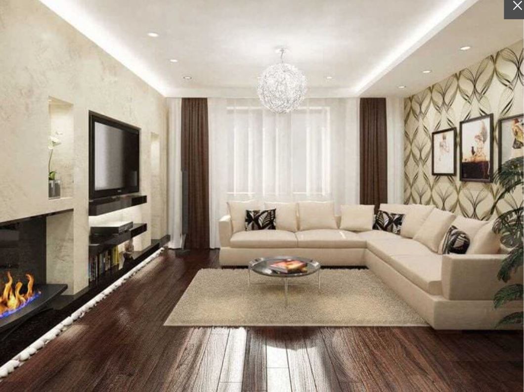 Нейтральная палитра, деревянный пол, пушистый ковер и камин – уютные атрибуты гостиной в частном доме