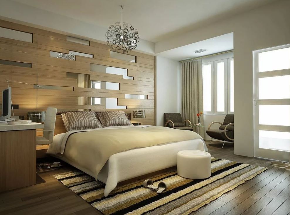 Удобные кресла и круглый пуф удачно гармонируют с остальными элементами меблировки модерновой спальни
