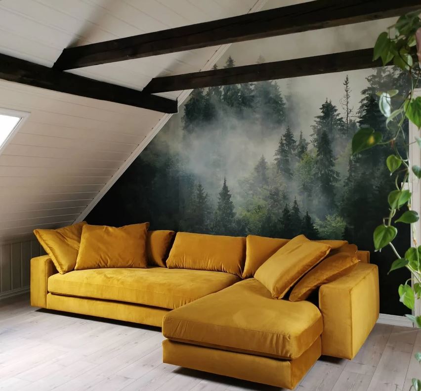 Угловой диван в мансарде на фоне 3D-обоев