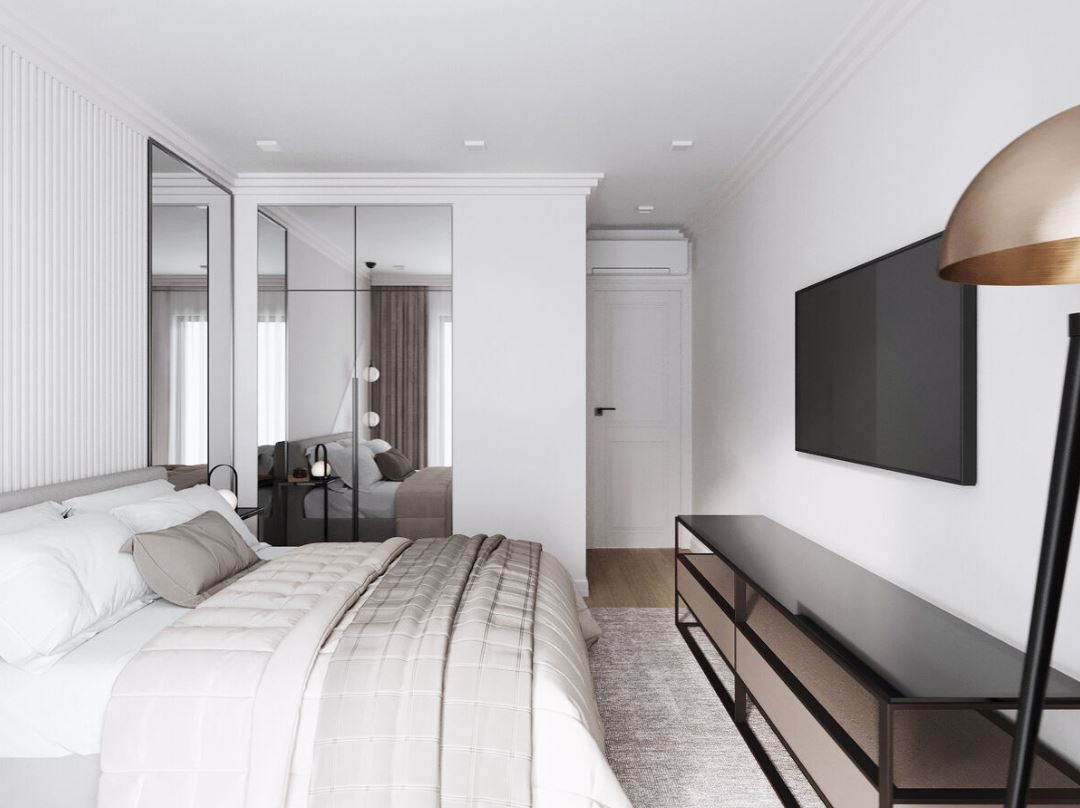 Зеркала на двух смежных стенах и белый цвет придают интерьеру спальни воздушности и объема